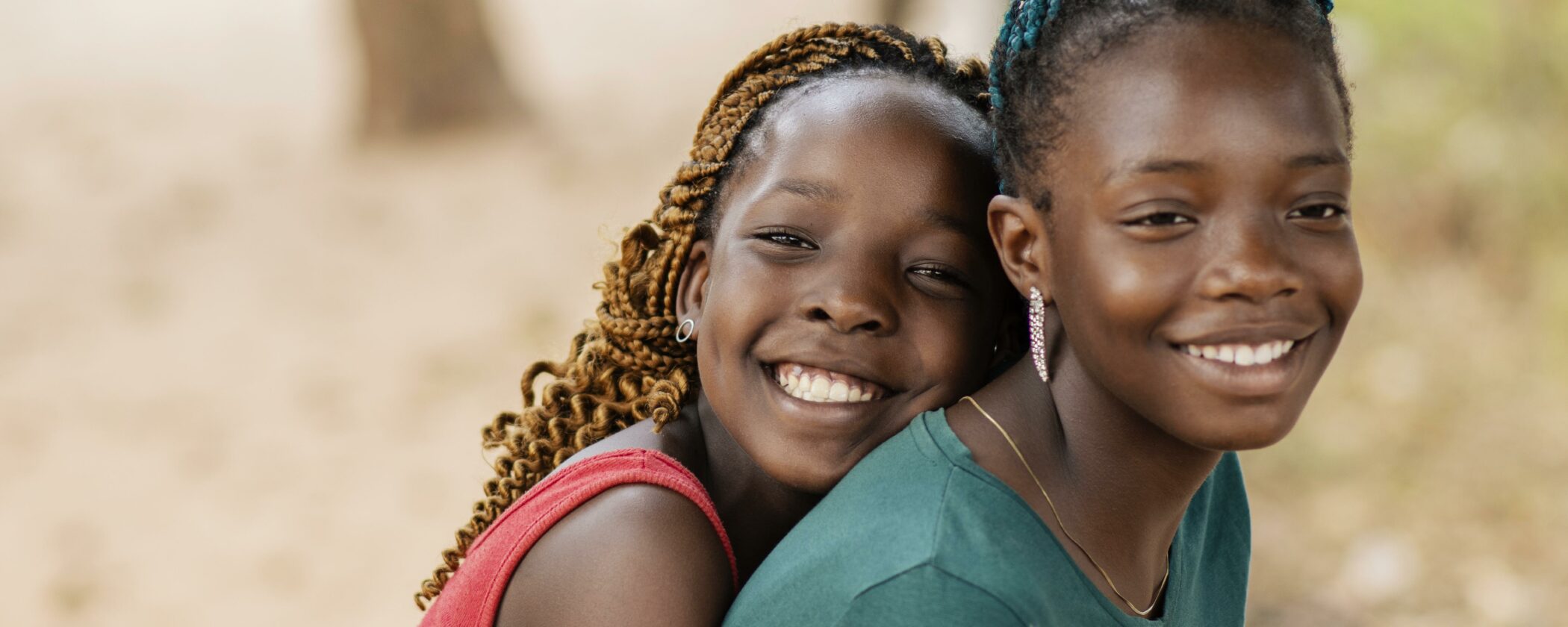 Close up smiley African girls outdoors.