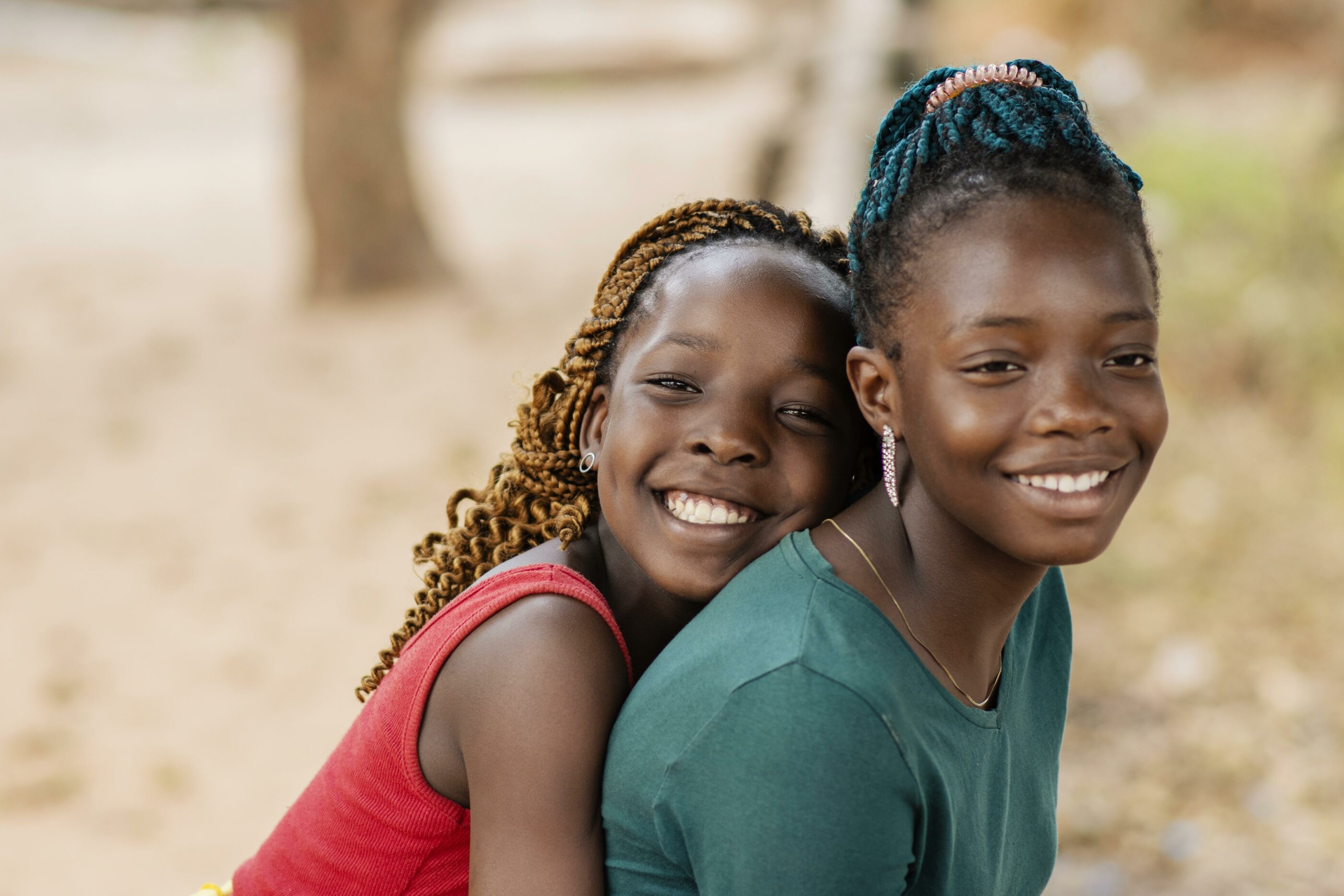 Close up smiley African girls outdoors.