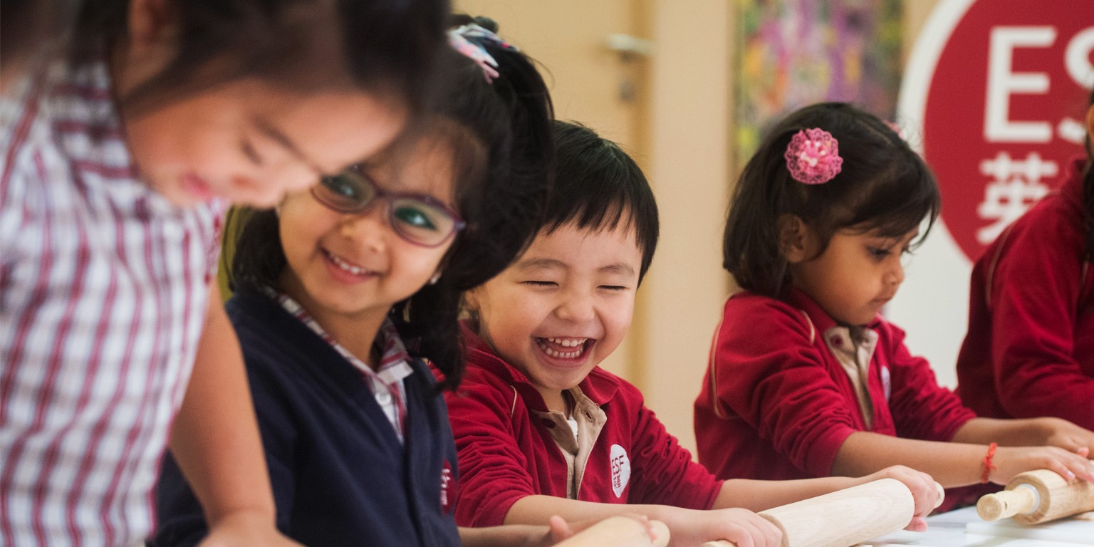 children laughing and looking at each other